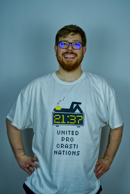 Man wearing a white t-shirt with a digital clock design, sleeping stick figure on top of it and below that graphic text against a plain background "United pro crasti nations"